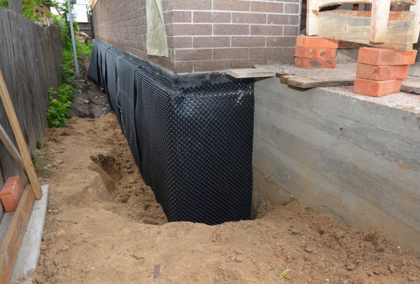 SJ Waterproofing Pros technician performing targeted Waterproofing assessment in Randallstown, MD